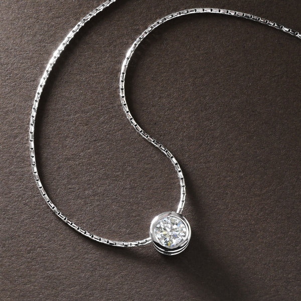 Dazzling Diamond Bezel Pendant In White Gold